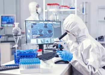 sterify-team-of-medical-personal-wearing-ppe-suit-doing-coronavirus-analysis-in-modern-laboratory-chemist-researcher-during-global-pandemic-with-covid-19-checking-sample-in-biochemistry-lab